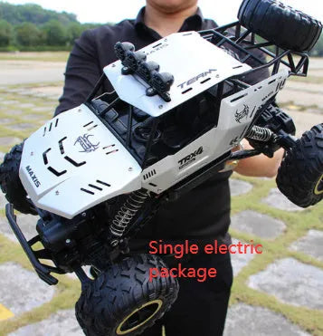Black and silver 4WD remote control off-road climbing cars on rough terrain showing two size options.