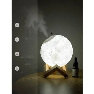 Wood finish Lunar humidifier night light with spherical design on a table.