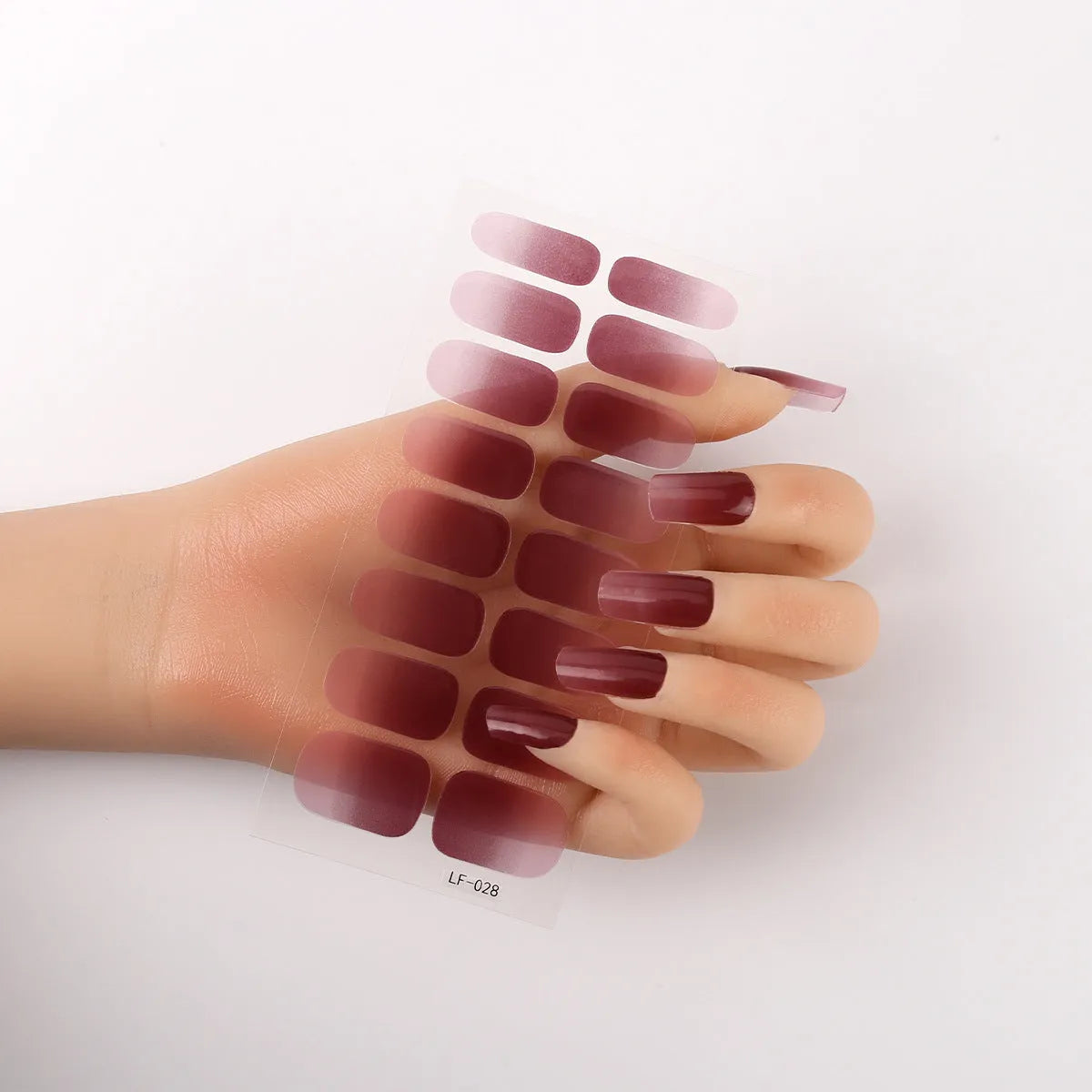 16 solid colour full nail art stickers with 22 patterns including cross, rose, butterfly designs in 12x6mm oval size