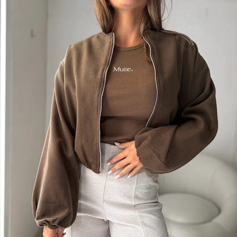 Women's off-shoulder short coat with lantern sleeves in brown colour showing round neck and pocket details