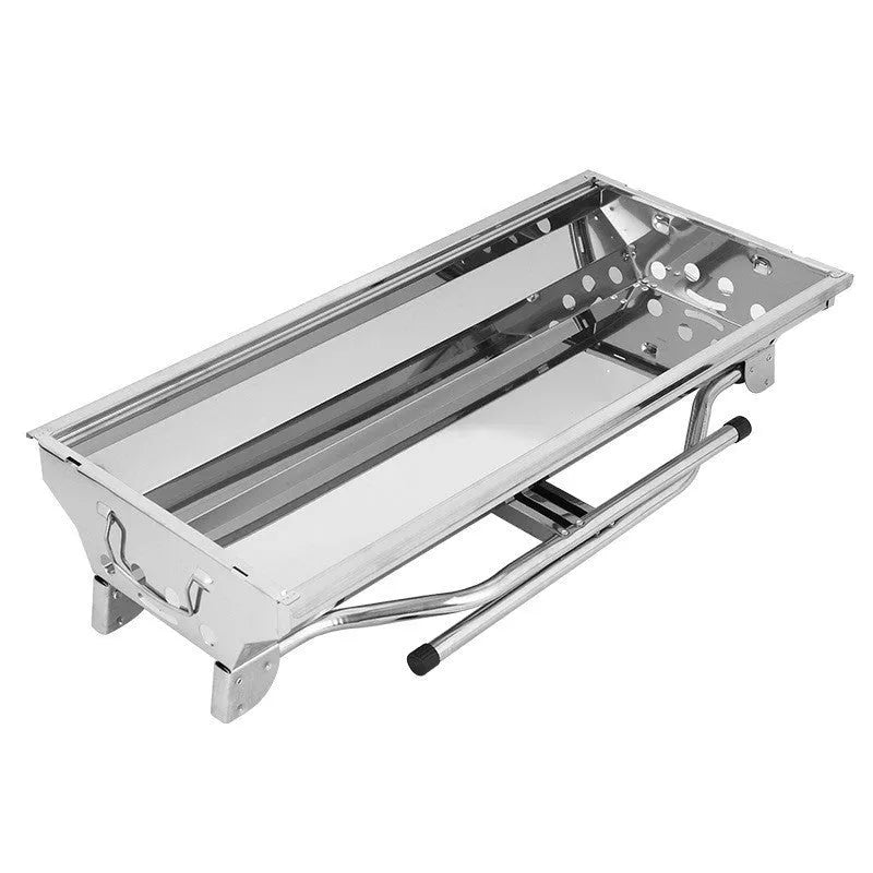 Stainless steel portable folding barbecue grill with cooking grate, shown in a natural colour.