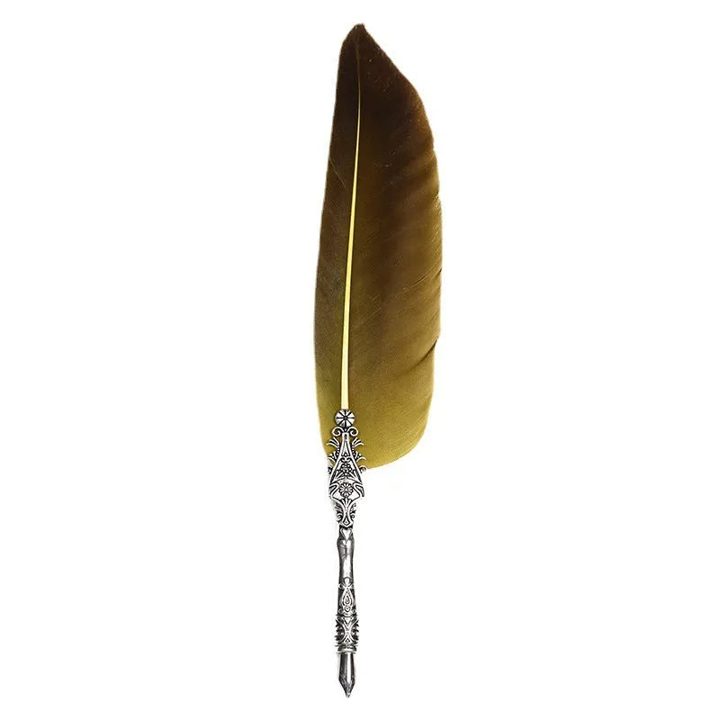 Vintage feather dip pen with zinc alloy holder in assorted colours on a wooden desk