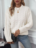 Beige women's loose casual sweater with a textured twist detail on the front.