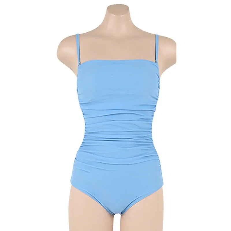 Women's sling style one-piece swimsuit with belly pleating in solid colour.