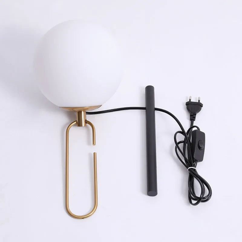Clear glass Nordic wall lamp with three light colour options on white wall