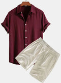 Men's solid colour casual short-sleeved shirt and shorts suit set on a hanger.