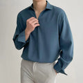 Men's loose lapel casual pullover shirt in solid colour on a hanger, shown in white, black, blue and skin tone options.