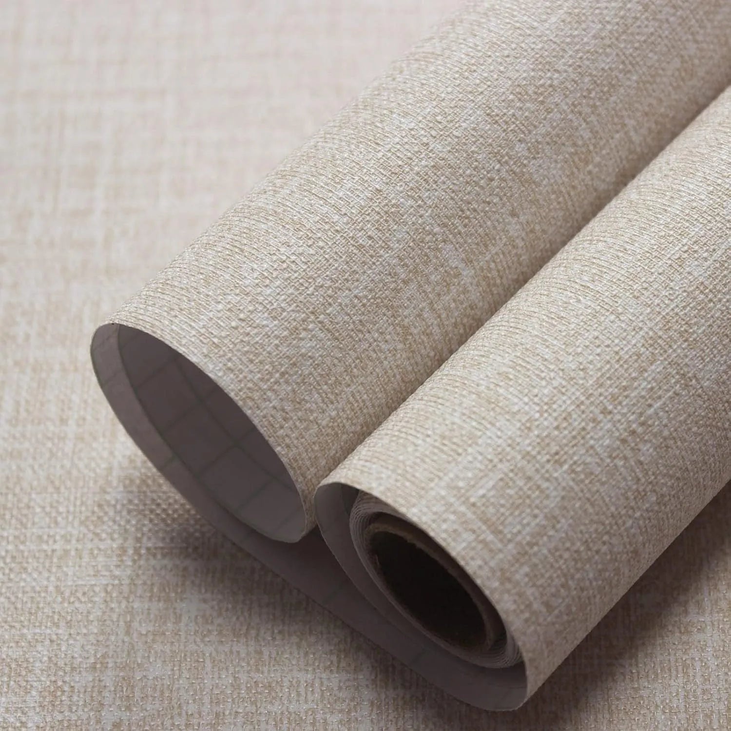 Roll of gray linen self-adhesive wallpaper with textured double-layer surface