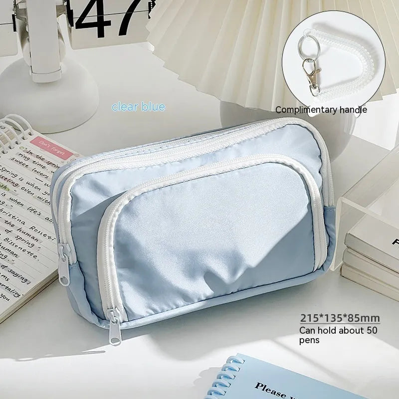 Double layer pencil case in solid colour with gift handle showing interior compartments