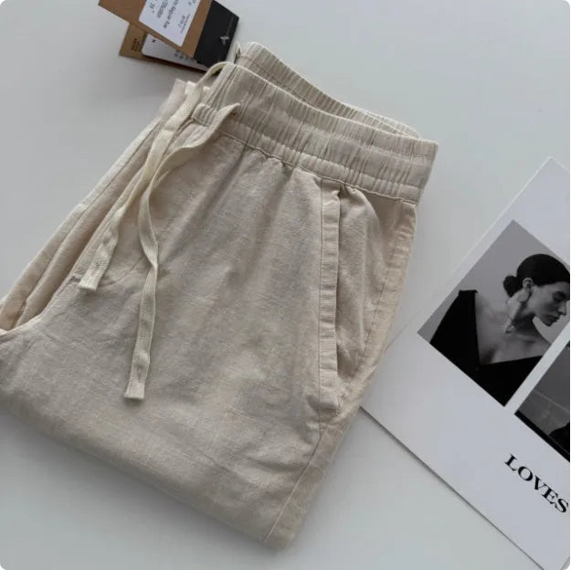 Men's loose straight leg casual trousers with drawstring waist in beige, black, green, grey, and navy blue colours
