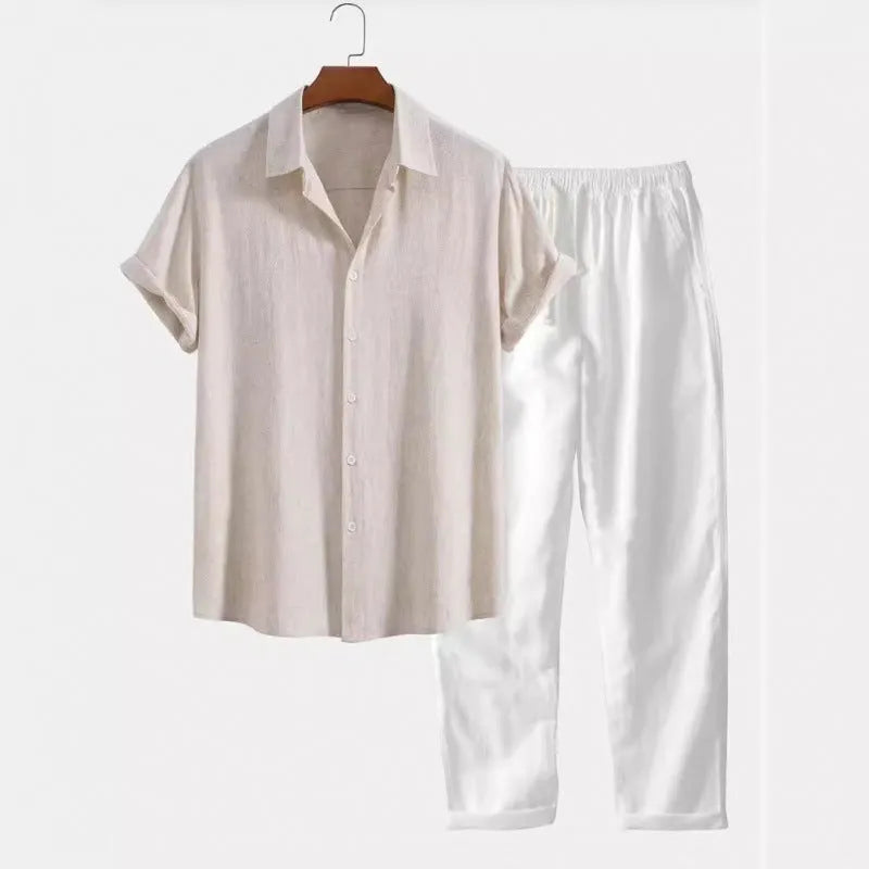Man wearing a loose-fit short sleeve shirt and matching trousers from a casual linen-look polyester suit.