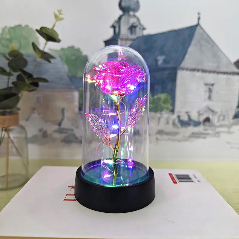 Glass cover small night lamp with plastic flowers in 15cm tall design with black base