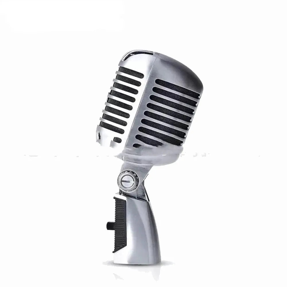 Gold all-metal dynamic handheld microphone on a stand.