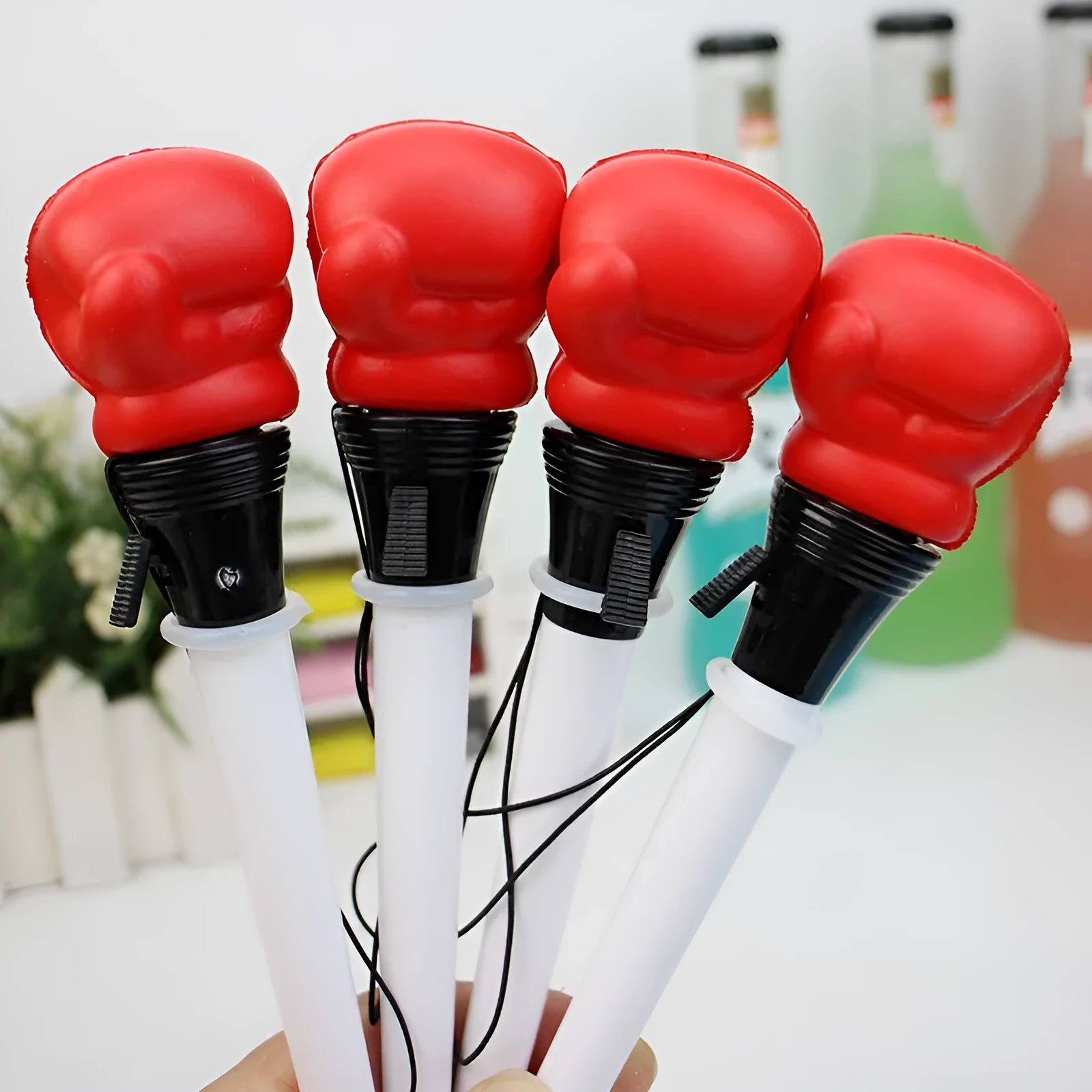 Four boxing press ejection pens with black ink and 0.7mm bullet tips