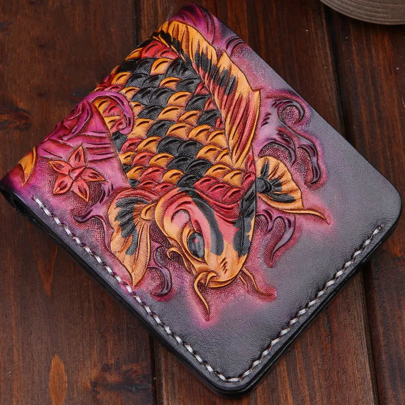 Hand-carved men's leather wallet in navy blue, showing slim profile and open design on a wooden table.