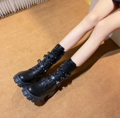 Black women's mid-calf boots with a metal buckle strap and side zip on a round toe.
