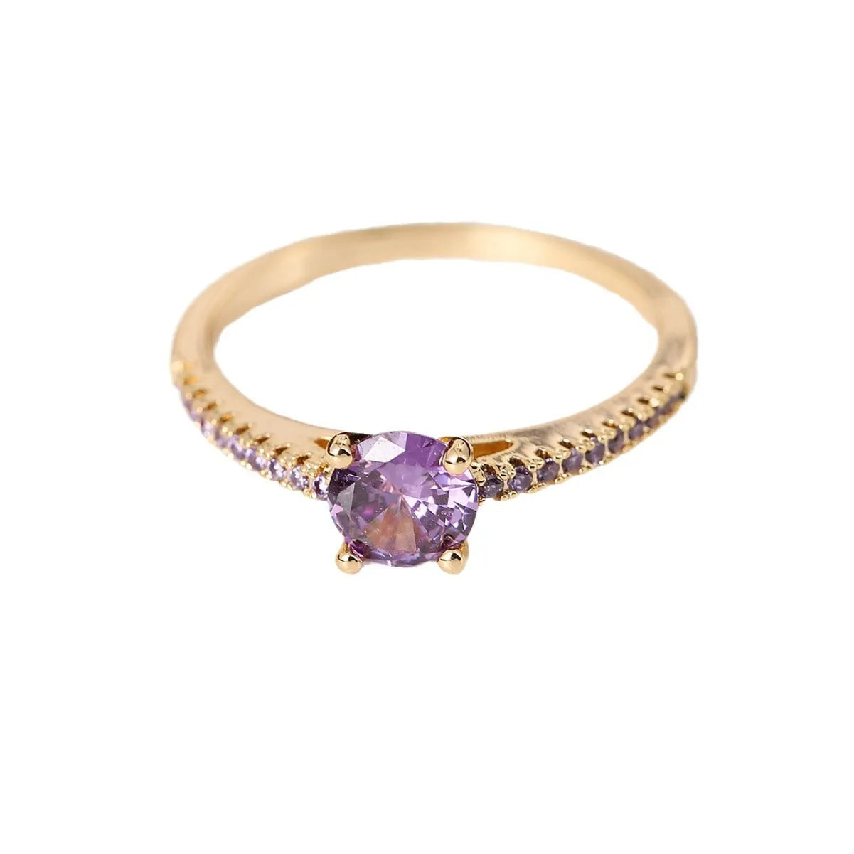 Close-up of a hexagonal geometric copper ring with a central zircon stone in a gun black and purple electroplated finish.