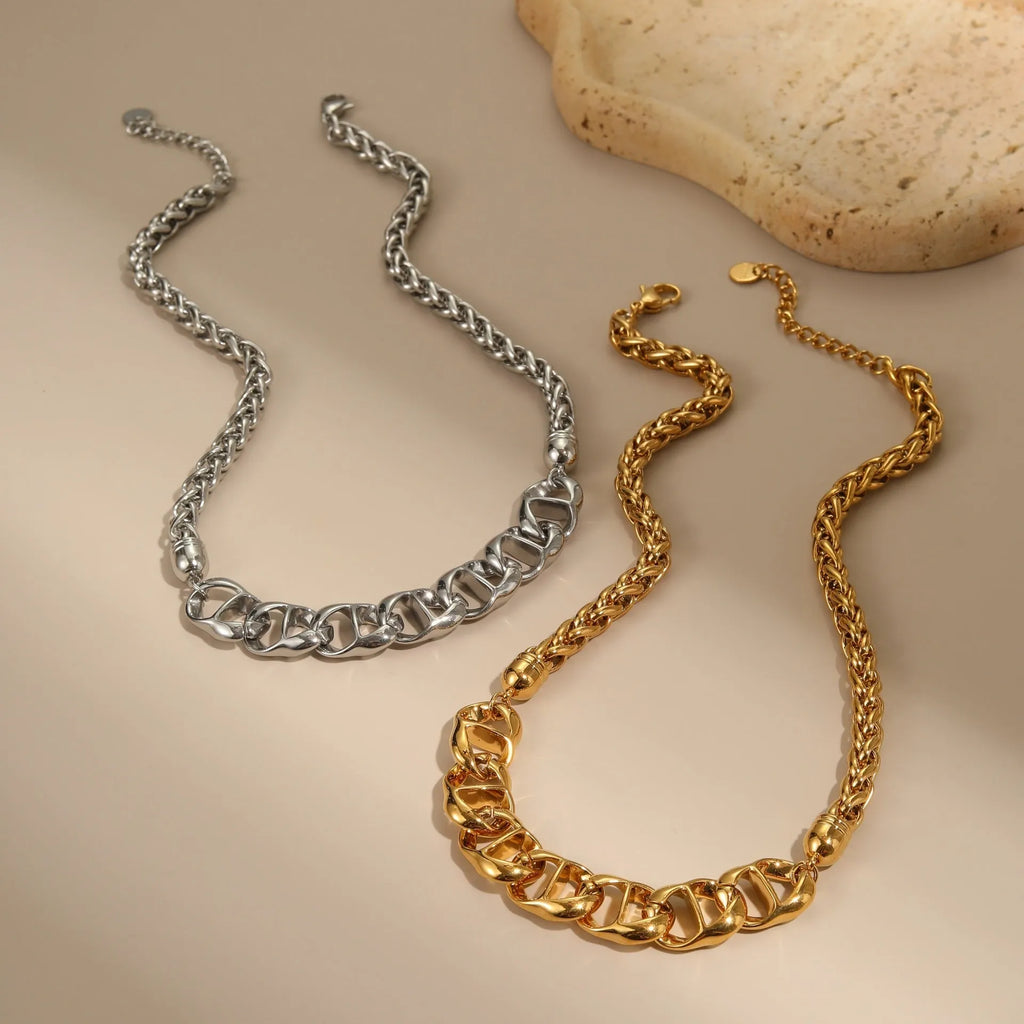 Stainless steel geometric pendant necklace with gold electroplated finish on a regular chain.