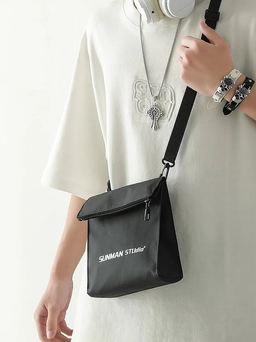 Simple all-match messenger bag backpack in polyester with adjustable crossbody strap, showing sewing line detail