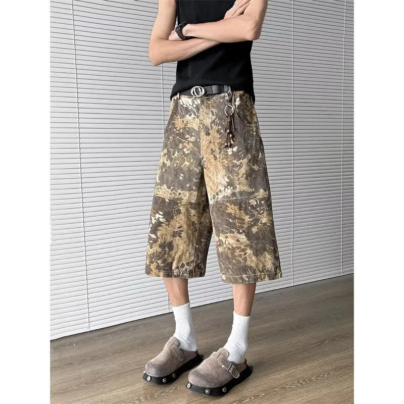 Yellow cotton denim jeans with snake camouflage pattern and cropped leg length.