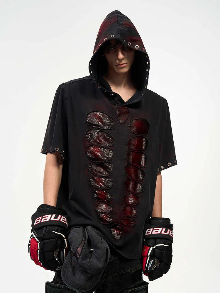 Black loose-fit men's hooded sequin T-shirt on a hanger