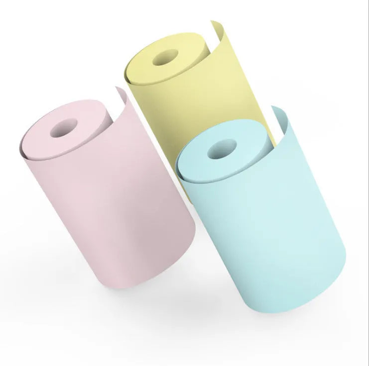 Bluetooth mobile mini thermal printer in pink with paper rolls and USB cable