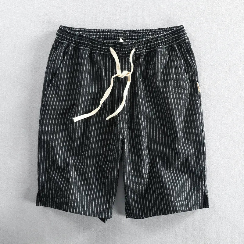 Men's striped casual shorts with elastic waistband in turmeric colour showing loose straight cut