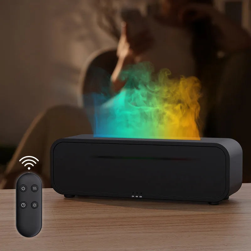 Black and white USB essential oil aromatherapy diffuser with colour-changing lights and remote control on a table
