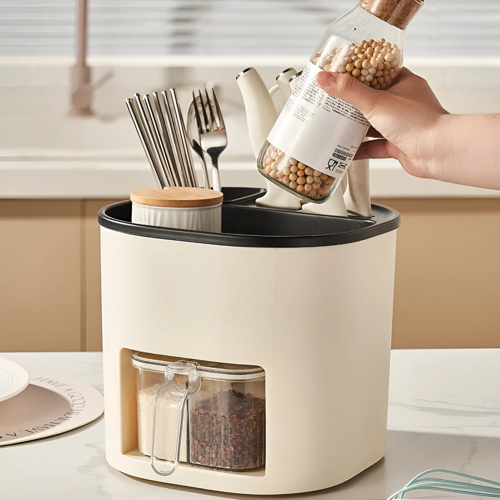 Plastic 360-degree rotating kitchen storage organiser with four compartments holding cutlery and a spice box