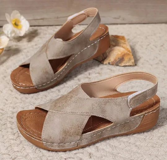 Roman platform sandals with ankle skirt and adjustable Velcro straps in a khaki colour.