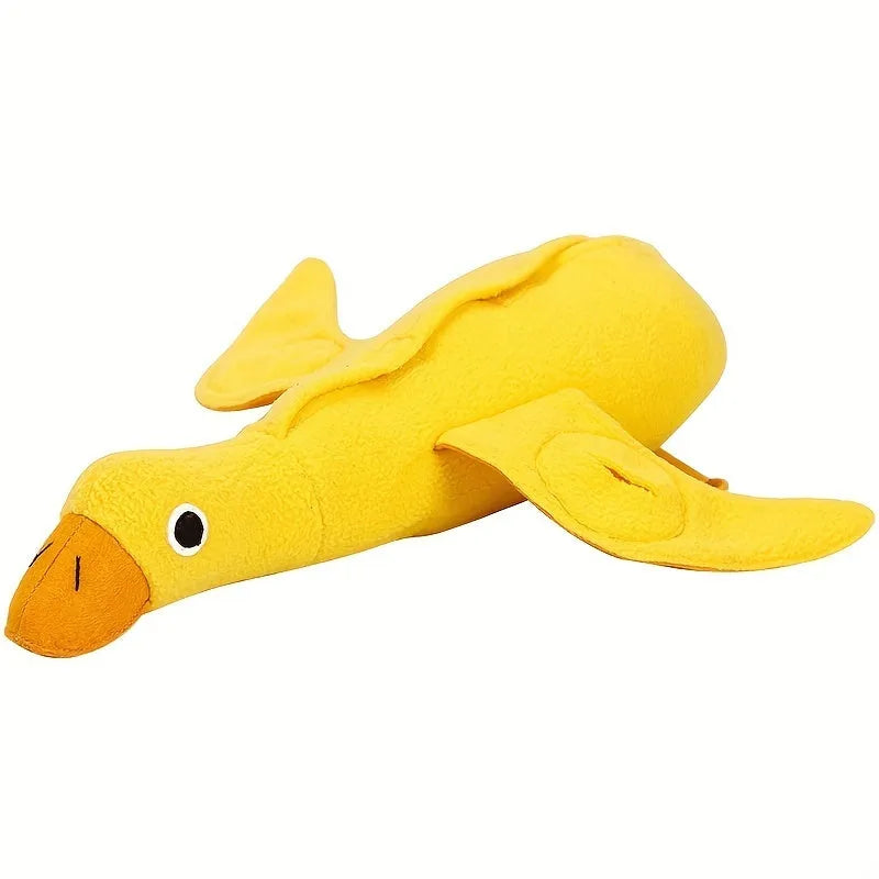 Yellow plush duck dog training toy with a squeaker and treat compartments on a white background.
