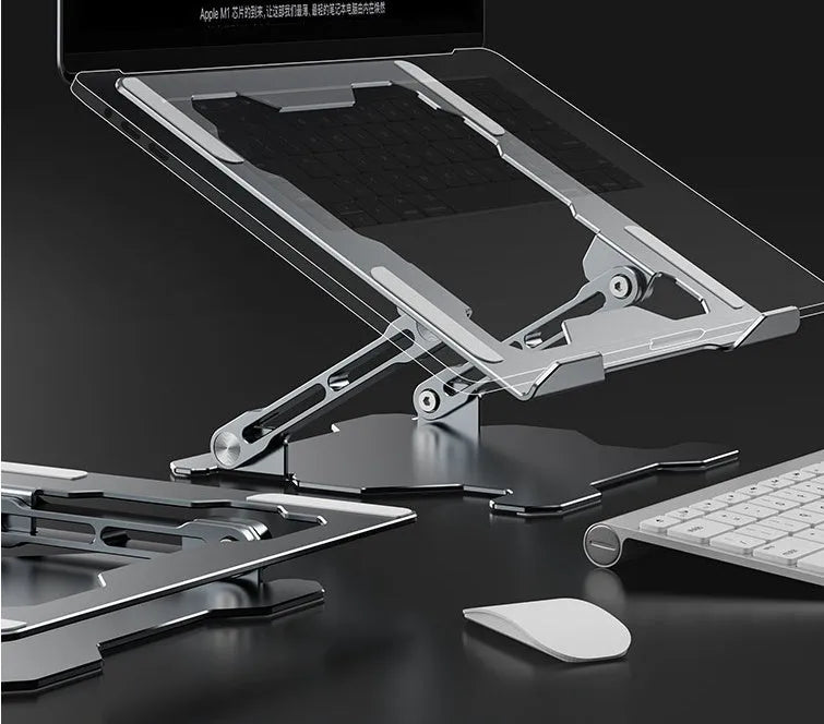 Grey aluminium adjustable laptop stand holding a silver laptop, showing its hollow design and folded position.