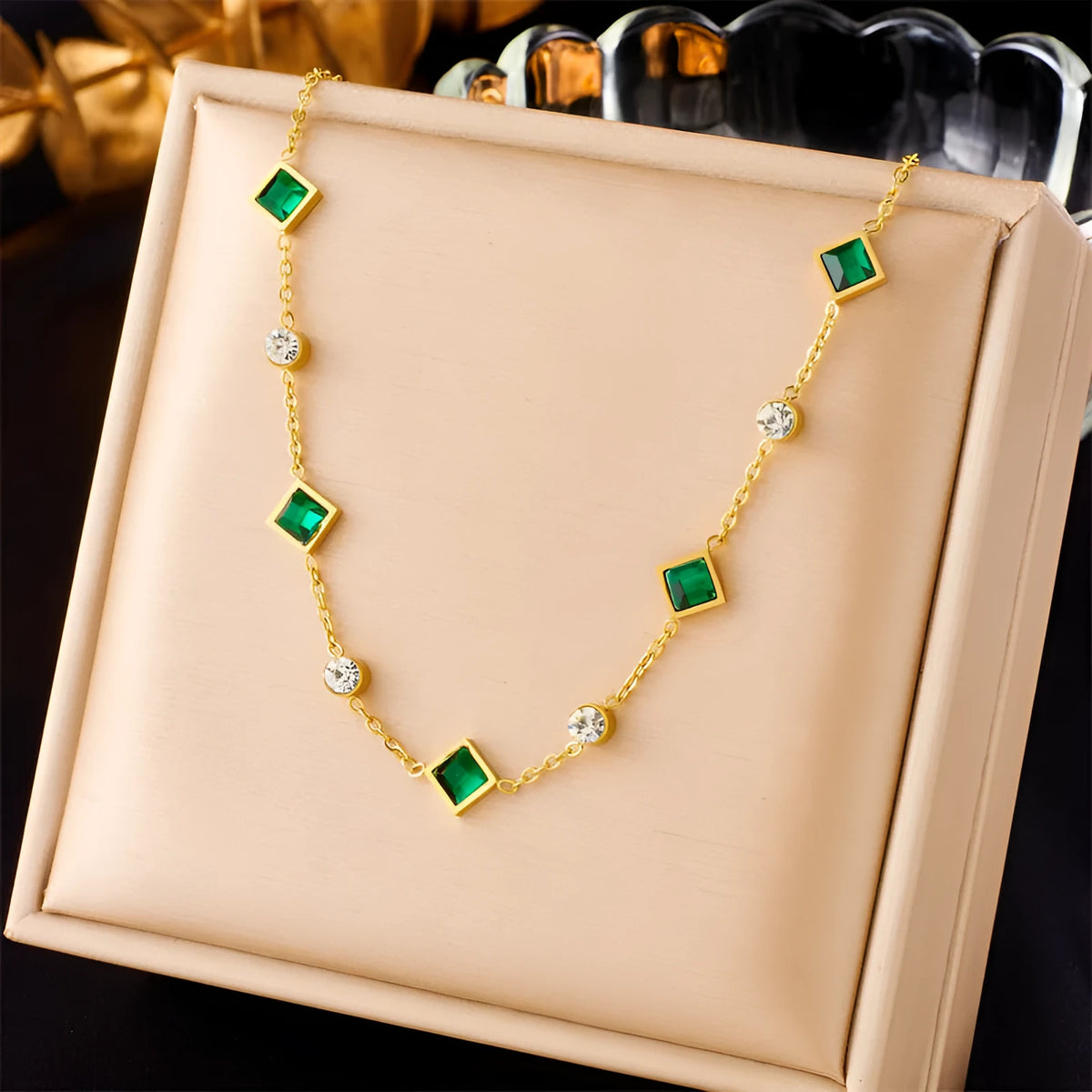 Gold titanium steel necklace with U-shaped pendant, square emerald zircon, and cross chain, 41-50cm.