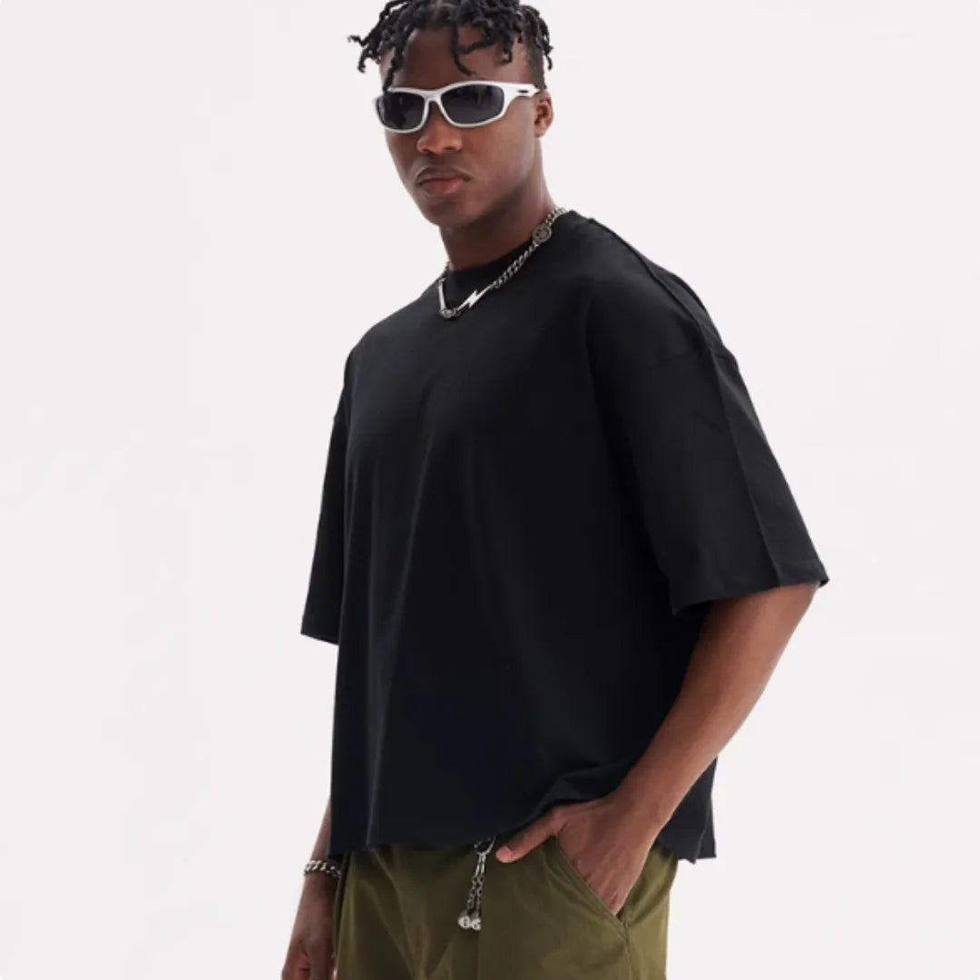 Loose fit pure cotton T-shirt on a hanger, shown in apricot colour.