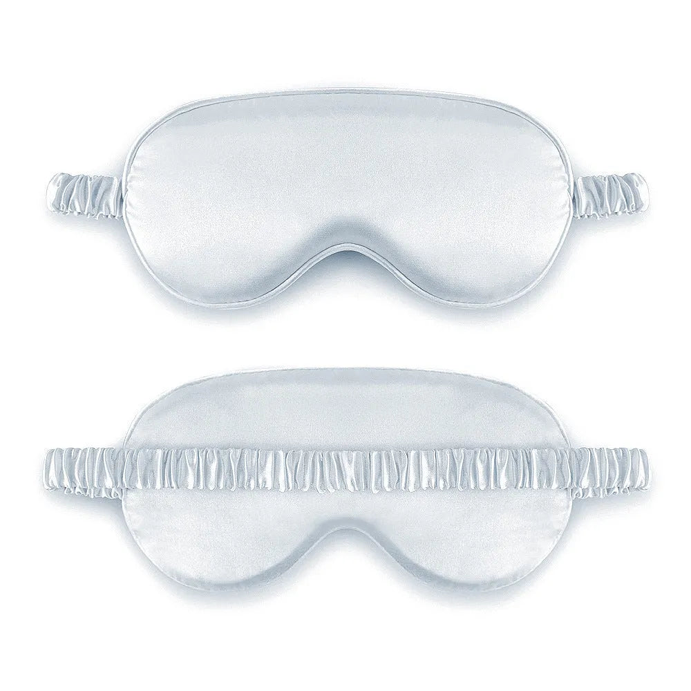 Rayon satin double-sided sleep mask in a selection of solid colours on a white background.