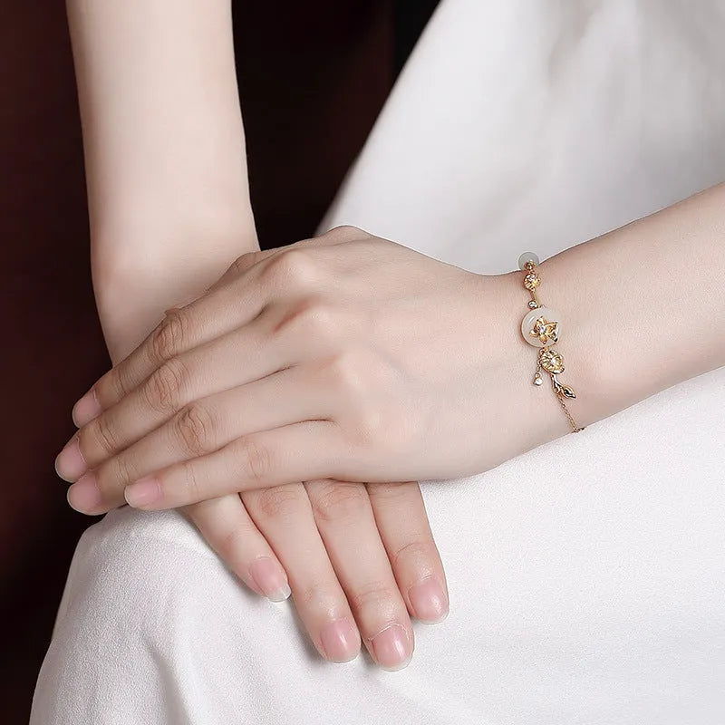 Women's 925 silver bracelet with Hetian jade lotus peace buckle in gold finish