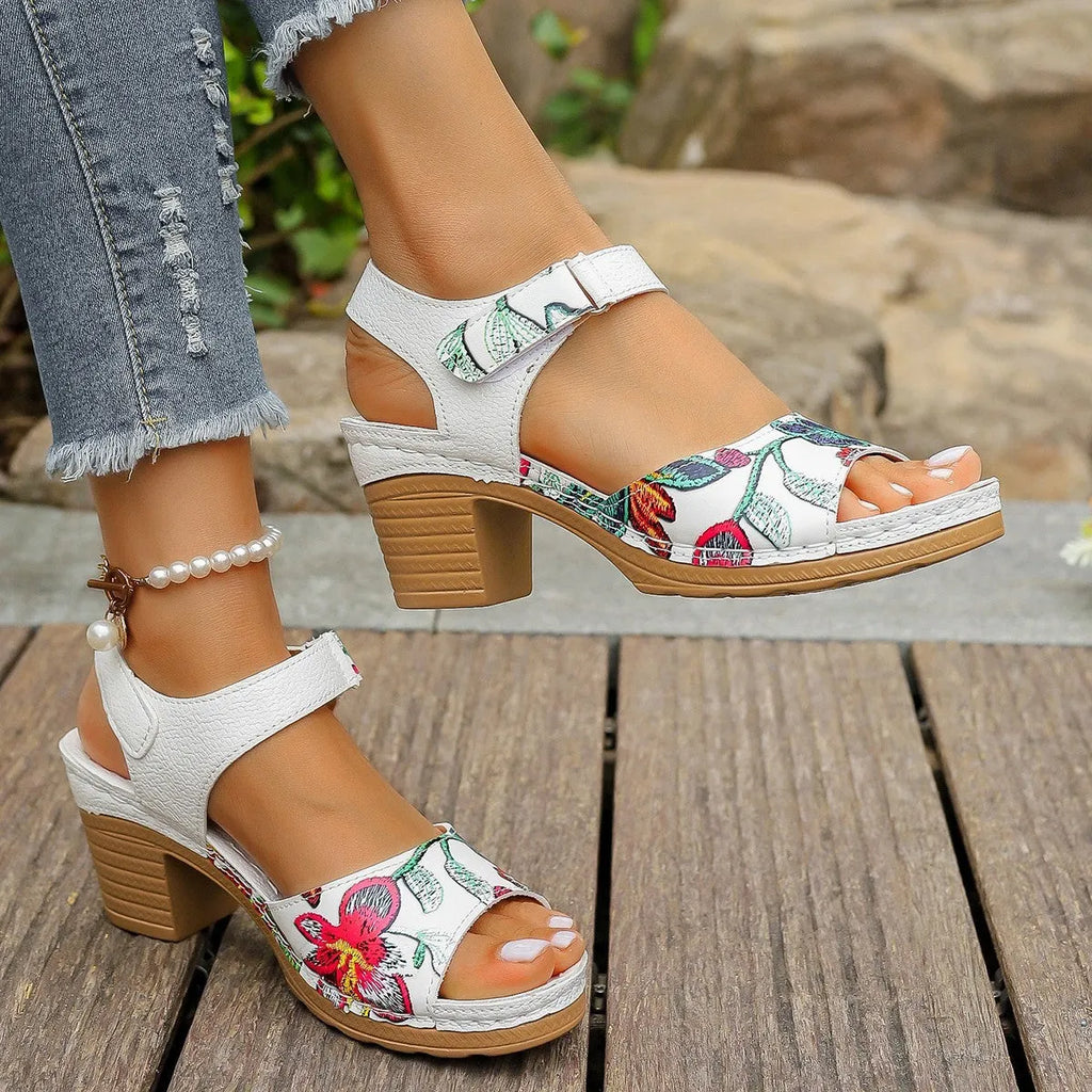 White women's high heel sandals with a Velcro buckle strap and rubber sole