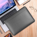 PU leather laptop sleeve bag in dark blue with soft handle and hook and loop closure, sizes 13.3 to 16 inches