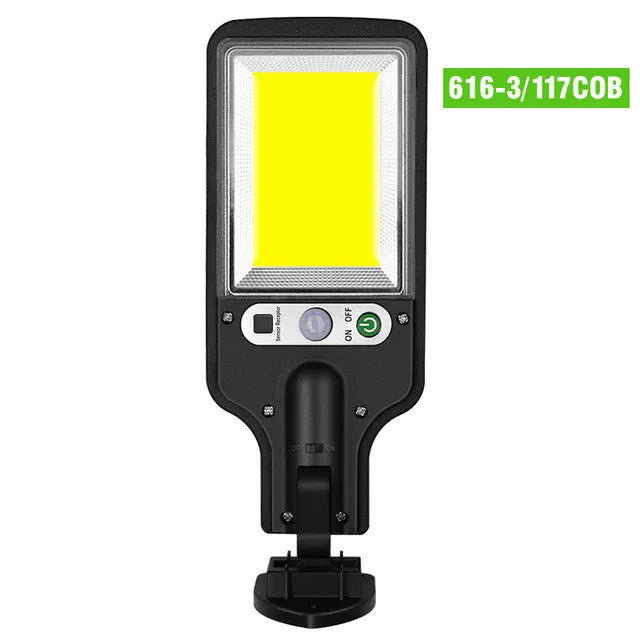 Outdoor solar LED wall lamp 28LED variant mounted on a garden fence for patio lighting