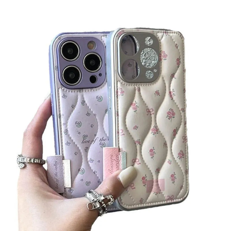 Creative down jacket small floral leather phone case with embossed design for iPhone showing purple background