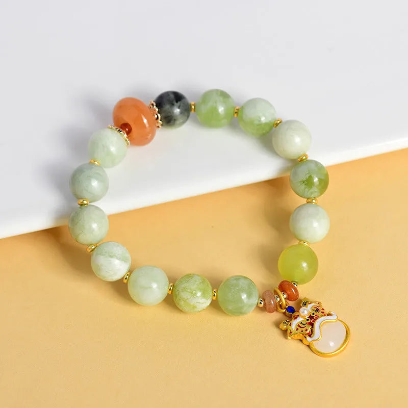 Green milk-in-water xingshi jade geometric pendant bracelet with silver-toned chain