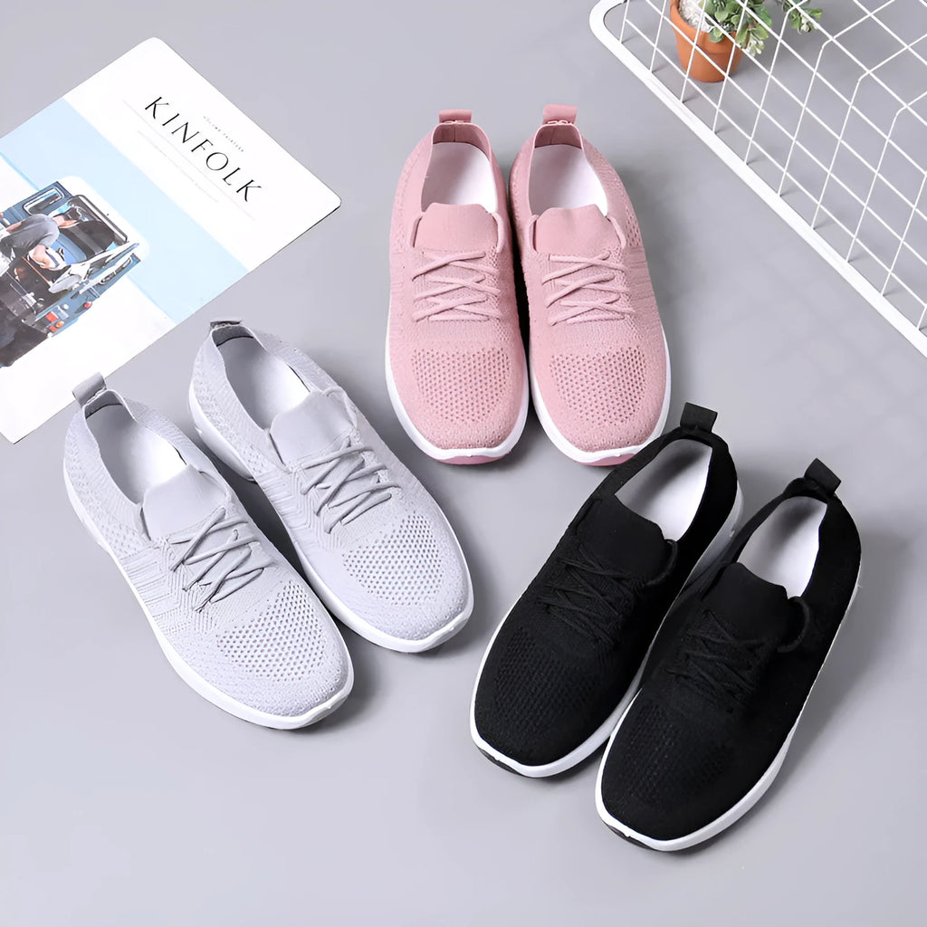 Women's lace-up casual sneaker in grey mesh with a round toe and soft PVC sole.