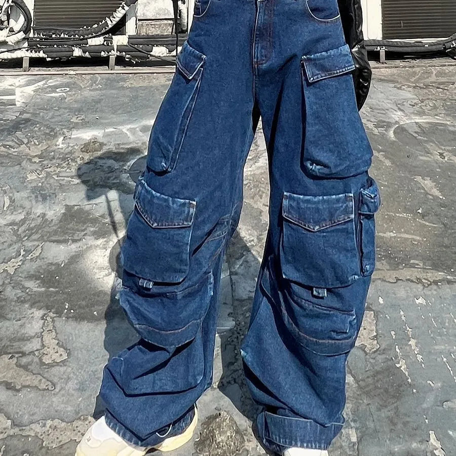 Dark blue distressed women's wide-leg jeans with a high waist and multiple pockets on a neutral background.