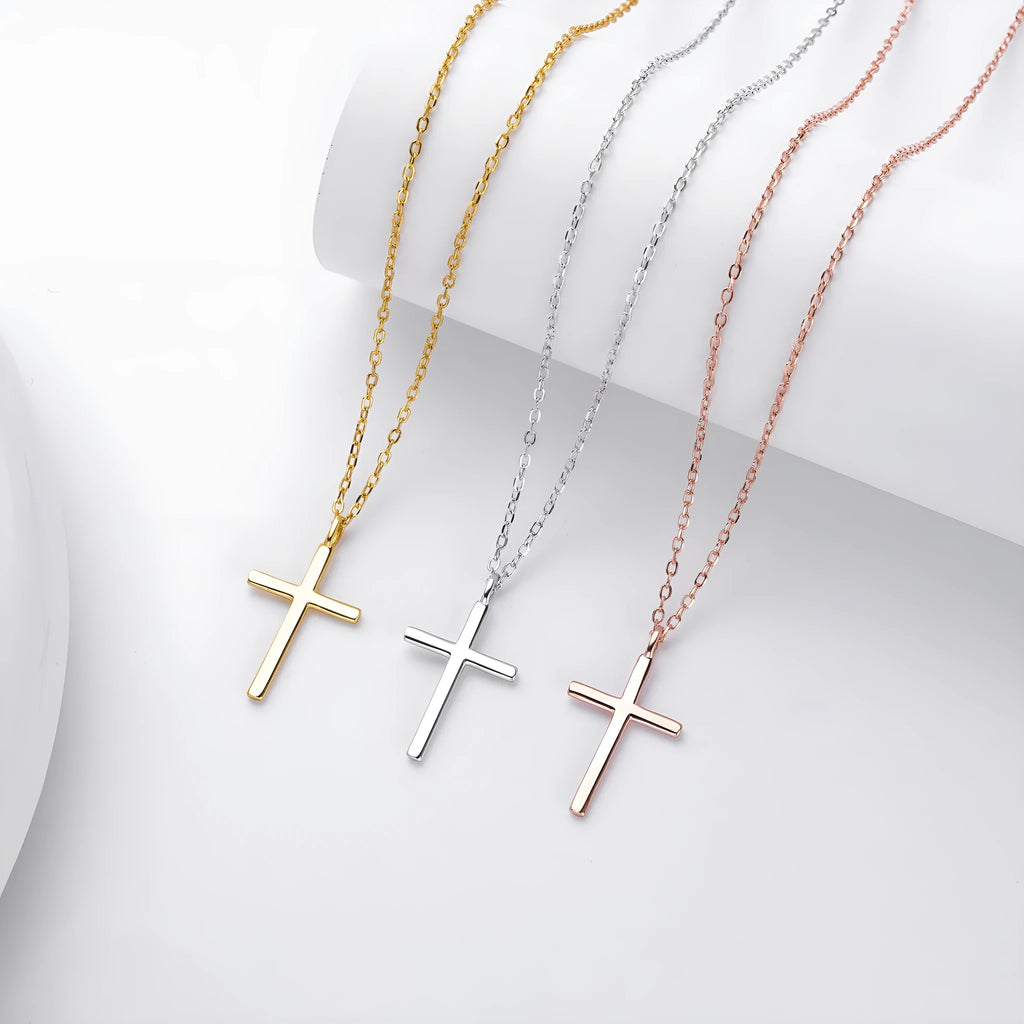 S925 sterling silver necklace with a simple glossy cross pendant on an O-shaped chain in a choice of gold, platinum, or rose gold plating.