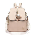 Genuine leather backpack with pendant and spliced belt detail for students and travellers, available in beige