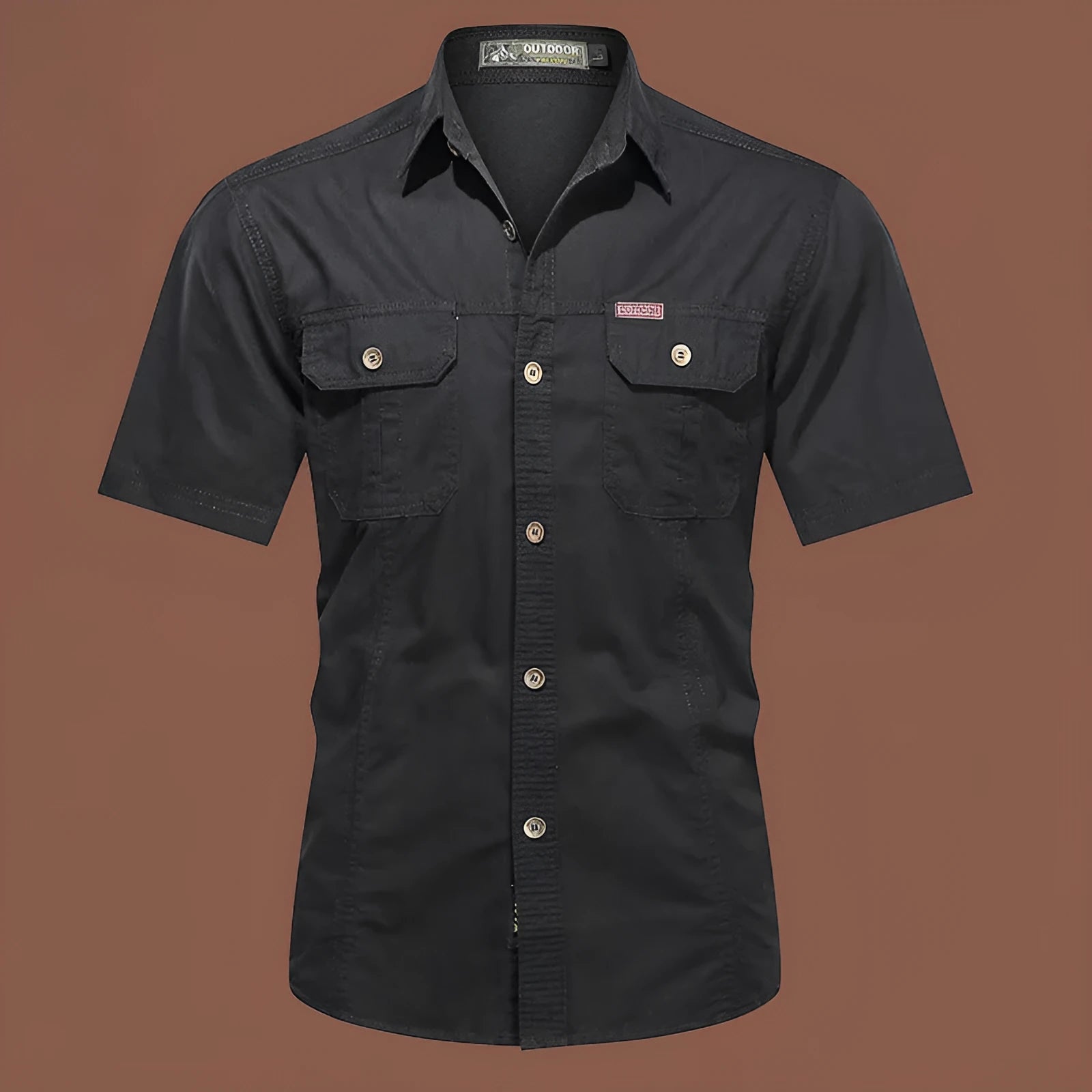 Man wearing a loose-fitting short sleeve cotton work shirt in a cardigan style.