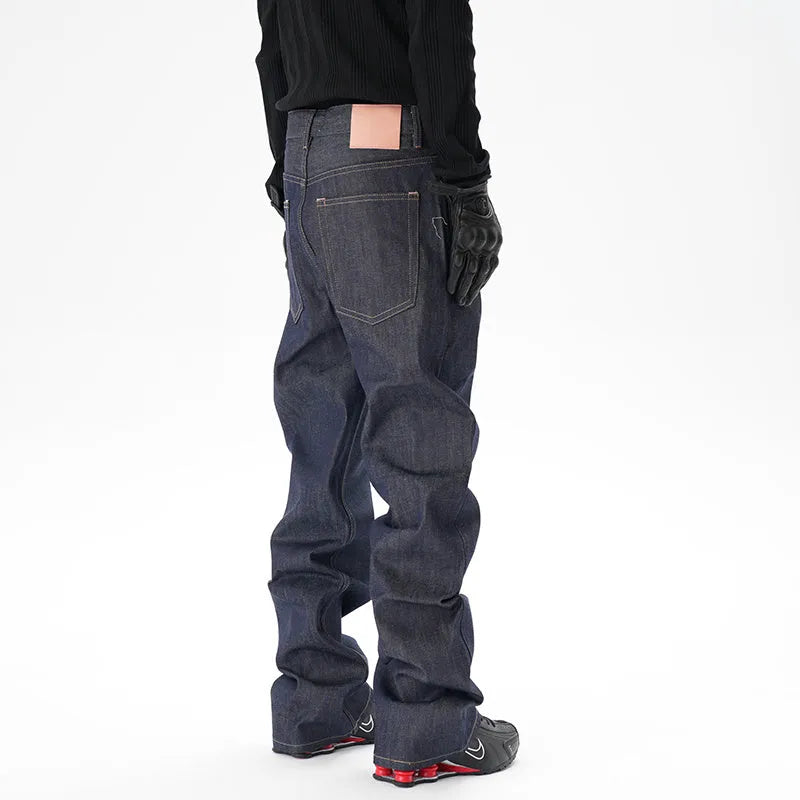 Man's dark blue loose straight-leg casual jeans on a white background.