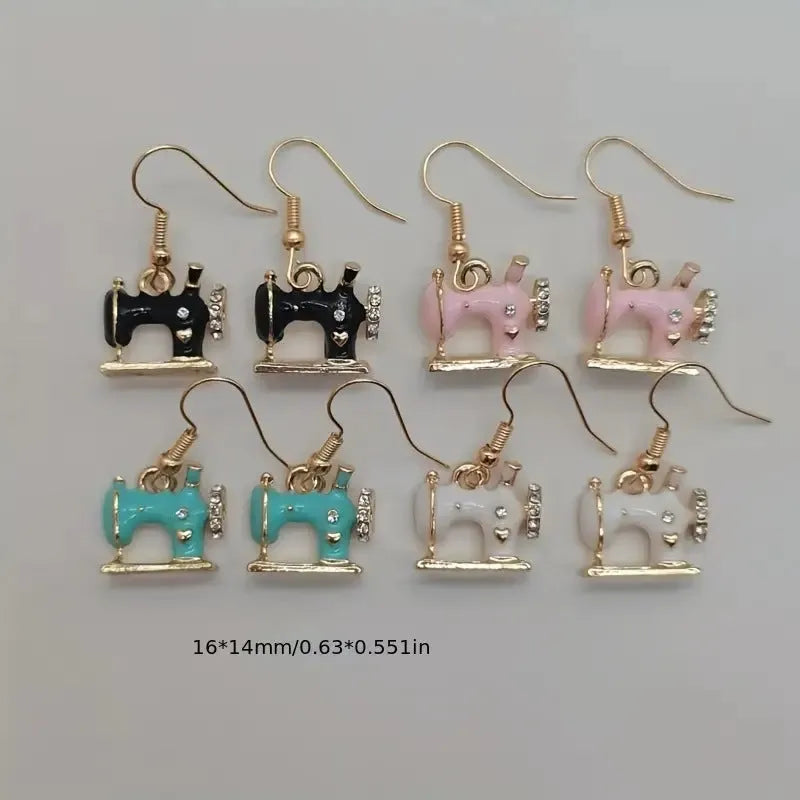 Vintage stereo sewing machine earrings in alloy with oil drip finish, shown in pink, black, white, and blue.