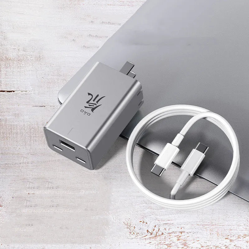 65W gallium nitride multi-port charger in grey with two USB-C and one USB-A ports