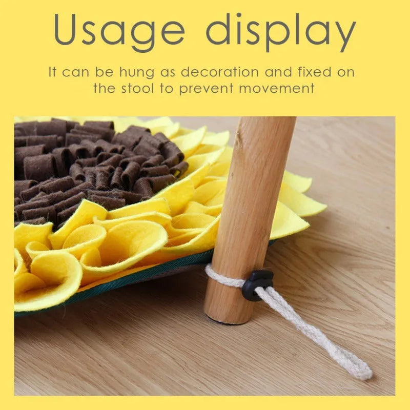Yellow sunflower-shaped dog snuffle mat with fleece surface and a rope for hanging